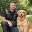 Professional male dog trainer working with golden retriever