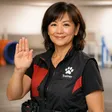 Experienced dog trainer demonstrating hand signal commands