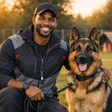 Athletic dog trainer with German Shepherd on leash